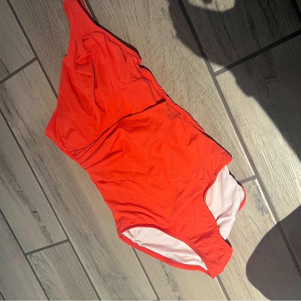 Tribal sport onepiece swimsuit. Roushed middle. One strap. Worn twice. Like new.